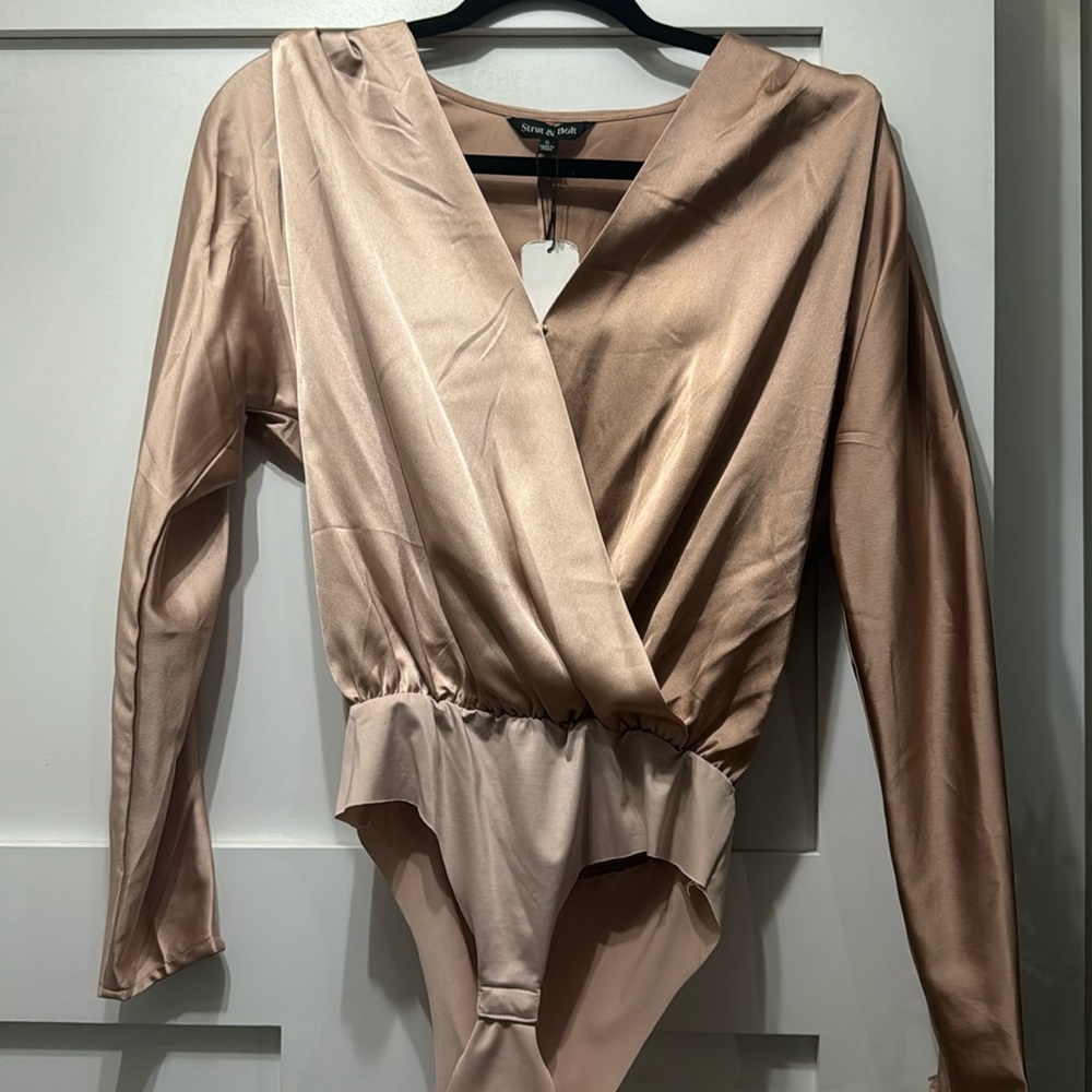 Champagne and Taupe split color v neck bodysuit. NWT